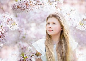 girl photographed in the cherry blossom tree at the Cambridge Botanical Gardens