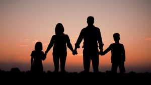 silhouette of a family during a sunset photoshoot in Newmarket