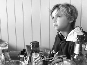 child sitting in a restaurant