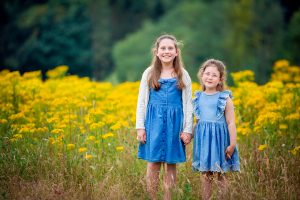 sisters in a flower field