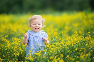 toddler in a flower field