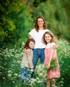 family having fun in cow parsley during a mini photoshoot in fulbourn, Cambridgeshire