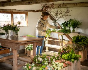cambridge florist Amelia Cornish, photographed in her studio during a personal branding photoshoot