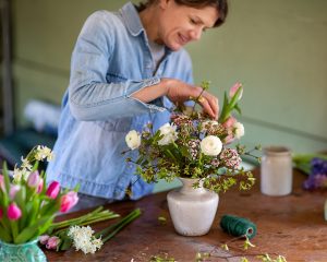 Cambridge florist, Amelia Cornish, working in her studio during a personal branding photoshoot