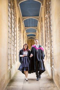 Students walking through the Bridge of Sighs at St Johns College Cambridge