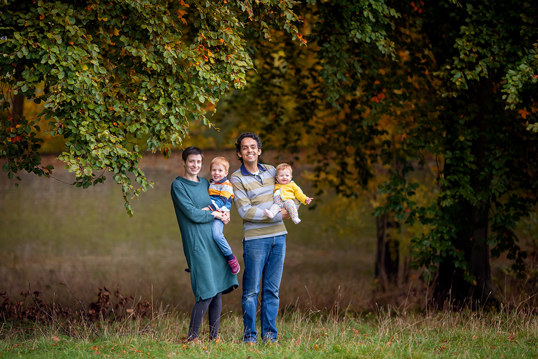 family wiht you children uring an autumn photoshoot in cambridgeshire